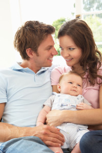 http://www.dreamstime.com/stock-photos-parents-cuddling-newborn-baby-boy-home-image15586853